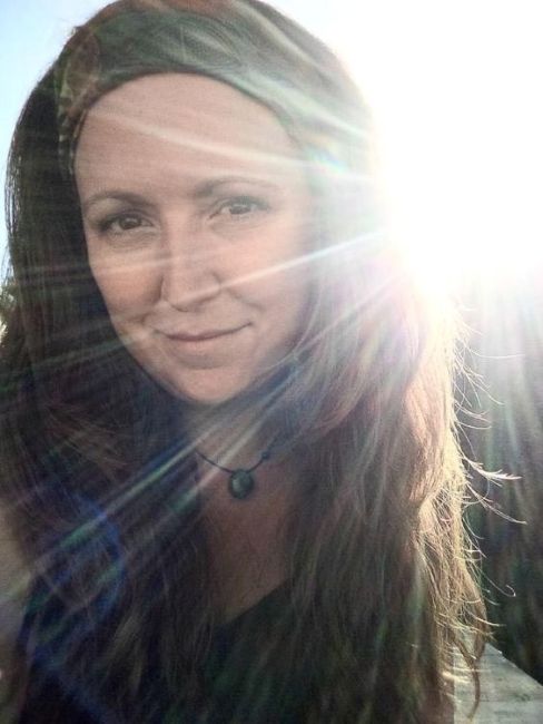 Yoga instructor for Guelph class within tropical greenhouse, including sound bath